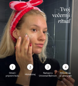 a woman applying cream on her face